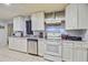 Well-equipped kitchen with ample cabinet space, stainless steel appliances, and tile flooring at 7074 W Constellation Dr, North Charleston, SC 29418