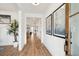 Spacious foyer with hardwood floors, leading to a living area and featuring a decorative potted plant at 725 Maynard Ln, Summerville, SC 29486