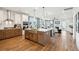 Open-concept kitchen featuring a large island, stainless steel appliances, and hardwood floors at 725 Maynard Ln, Summerville, SC 29486