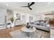 Inviting open living area with seamless connection between the kitchen, dining area, and cozy seating arrangement at 725 Maynard Ln, Summerville, SC 29486