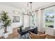 Home office with stylish desk, modern lighting, neutral decor, and ample natural light at 725 Maynard Ln, Summerville, SC 29486