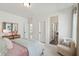Bright bedroom featuring a large bed, a stylish mirror and lots of natural light at 729 Maynard Ln, Summerville, SC 29486