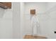 Walk-in closet with built-in shelving and a hanging rod with a white bathrobe at 729 Maynard Ln, Summerville, SC 29486