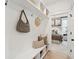 A home's entry has a bench with storage and decor, next to a doorway to a bedroom at 729 Maynard Ln, Summerville, SC 29486