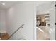 The upstairs hallway leads to a staircase and a bedroom with natural light at 729 Maynard Ln, Summerville, SC 29486