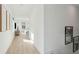 Bright hallway with wood floors and recessed lighting, leading to the living spaces at 729 Maynard Ln, Summerville, SC 29486