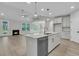 Open-concept living room flows into a modern kitchen with an island and stainless appliances at 731 Maynard Ln, Summerville, SC 29486