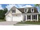 Charming two-story home with a two car garage and well-manicured lawn at 736 Maynard Ln, Summerville, SC 29486