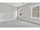 Bedroom with neutral walls, trim, plush carpet, and lots of natural light at 764 Maynard Ln, Summerville, SC 29486