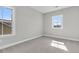 Bedroom with neutral walls, trim, plush carpet, and two bright windows at 764 Maynard Ln, Summerville, SC 29486