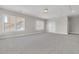 Large bonus room with neutral walls, trim, plush carpet, lots of natural light, and a closet at 764 Maynard Ln, Summerville, SC 29486