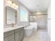 Luxurious bathroom with a large tub, walk-in shower, and modern vanity with granite countertops at 770 Maynard Ln, Summerville, SC 29486