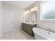 Modern bathroom featuring double sinks, granite countertops, and stylish gold fixtures at 770 Maynard Ln, Summerville, SC 29486