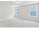 Comfortable bedroom featuring neutral carpet flooring and two bright windows for natural light at 770 Maynard Ln, Summerville, SC 29486