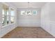 An airy dining room features wainscoting and hardwood flooring, and large windows at 770 Maynard Ln, Summerville, SC 29486