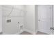 Functional laundry room featuring tiled floors, overhead wire shelving and utility hookups at 770 Maynard Ln, Summerville, SC 29486