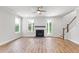 Bright living room with fireplace, hardwood floors, and access to outdoor living space at 770 Maynard Ln, Summerville, SC 29486