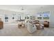 Bright bonus room with comfortable seating, a dining table, and views of a pond from multiple windows at 772 Maynard Ln, Summerville, SC 29486