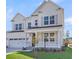 Charming two-story home showcasing a white exterior, front porch, and well-maintained landscaping at 776 Maynard Ln, Summerville, SC 29486