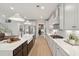 Modern kitchen featuring white cabinets, quartz counters, stainless appliances, and an island sink at 776 Maynard Ln, Summerville, SC 29486