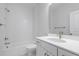Well-lit bathroom featuring tub and shower, vanity with white countertop and modern hardware at 778 Maynard Ln, Summerville, SC 29486