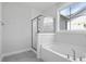 Clean bathroom featuring shower-tub combination and a large window for natural light at 778 Maynard Ln, Summerville, SC 29486