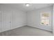 Comfortable bedroom with neutral carpeting, fresh paint, window with natural light, and convenient electrical outlets at 778 Maynard Ln, Summerville, SC 29486