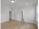Neutral bedroom featuring hardwood floors and a door leading to an en-suite bathroom at 778 Maynard Ln, Summerville, SC 29486