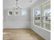 Elegant dining room with hardwood floors, decorative molding, and a modern chandelier at 778 Maynard Ln, Summerville, SC 29486
