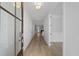 Bright foyer with light wood floors, white walls, and glass paneled front door at 778 Maynard Ln, Summerville, SC 29486