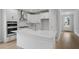 Bright, modern kitchen with a large center island, stainless steel appliances, and white cabinetry at 778 Maynard Ln, Summerville, SC 29486