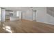 Inviting living space with hardwood floors seamlessly flowing into the kitchen area and a staircase at 778 Maynard Ln, Summerville, SC 29486