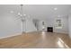 Spacious living room with fireplace, hardwood floors, and natural light streaming through the door at 778 Maynard Ln, Summerville, SC 29486