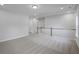 Open loft with neutral carpeting, white walls, and wood railing, bathed in natural light with convenient access to a hallway at 778 Maynard Ln, Summerville, SC 29486