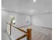 Spacious loft featuring neutral paint, plush carpeting, natural light, and a staircase with a wood railing at 778 Maynard Ln, Summerville, SC 29486