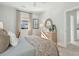 Bright bedroom featuring a large window, modern dresser, and comfortable bed with patterned bedding at 786 Maynard Ln, Summerville, SC 29486