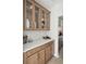 Butler's pantry with decorative glass front cabinets and stylish countertops at 786 Maynard Ln, Summerville, SC 29486
