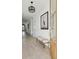 Bright hallway features wood floors, a stylish bench and light fixture with a picture on the wall at 786 Maynard Ln, Summerville, SC 29486