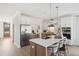 Bright kitchen featuring pendant lighting, stainless appliances, shaker cabinets, and island seating at 786 Maynard Ln, Summerville, SC 29486