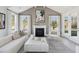 Living room boasts a fireplace, ample natural light, and chic, neutral-toned furnishings at 786 Maynard Ln, Summerville, SC 29486
