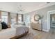 Light-filled main bedroom with calming decor, wood floors, and a modern chandelier at 786 Maynard Ln, Summerville, SC 29486