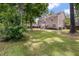 A spacious backyard with a lush lawn and mature trees at 8328 Berringer Bluff, North Charleston, SC 29418