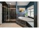 Bathroom features a separate shower with glass door and a soaking tub under a window at 8328 Berringer Bluff, North Charleston, SC 29418