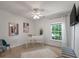 Bedroom area with white desk, contemporary art and light-filled window at 8328 Berringer Bluff, North Charleston, SC 29418