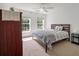 Bedroom featuring neutral decor, ceiling fan, two windows for ample natural light, and carpet flooring at 8328 Berringer Bluff, North Charleston, SC 29418