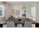 Bright dining room with modern decor, white walls, and seamless flow to the kitchen at 8328 Berringer Bluff, North Charleston, SC 29418