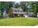 Traditional home featuring symmetrical facade, covered front porch, and manicured landscaping at 8328 Berringer Bluff, North Charleston, SC 29418