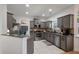 Well-lit kitchen featuring stainless steel appliances, granite countertops, and gray cabinetry at 8328 Berringer Bluff, North Charleston, SC 29418