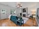 Comfortable living room with a fireplace, hardwood floors, and ample seating at 8328 Berringer Bluff, North Charleston, SC 29418