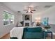 Cozy living room with stone fireplace, hardwood floors, and view of a large window at 8328 Berringer Bluff, North Charleston, SC 29418